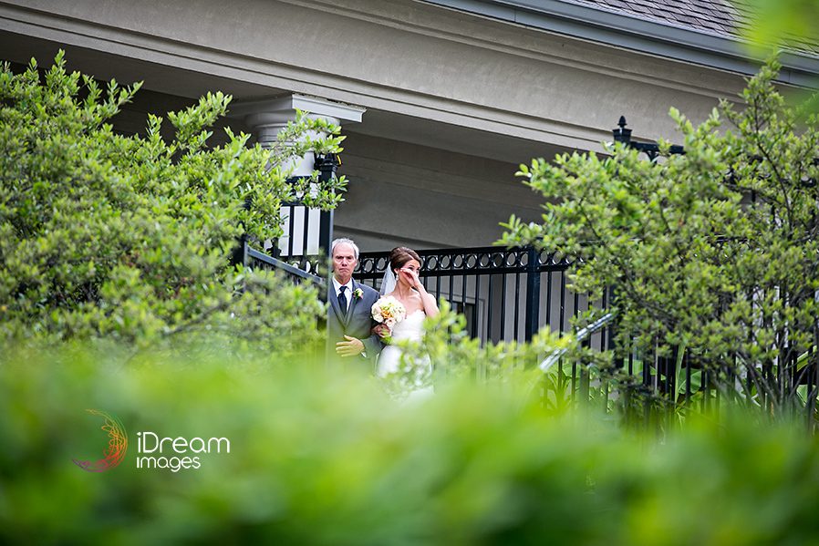 Bride and father walking to isle